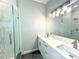 Modern bathroom with double vanity and glass shower at 6218 Bridleford Dr, Wesley Chapel, FL 33545