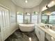 Spa-like bathroom featuring a freestanding tub and dual vanities at 6218 Bridleford Dr, Wesley Chapel, FL 33545