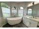 Bathroom with a free-standing soaking tub and modern vanity at 6218 Bridleford Dr, Wesley Chapel, FL 33545
