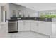 Spacious kitchen with island, stainless steel appliances, and white cabinets at 6218 Bridleford Dr, Wesley Chapel, FL 33545