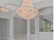 Spacious dining room with a large crystal chandelier at 6218 Bridleford Dr, Wesley Chapel, FL 33545