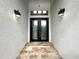Elegant entryway with double doors and stone flooring at 6218 Bridleford Dr, Wesley Chapel, FL 33545