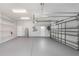 Two-car garage with overhead storage and epoxy floor at 6218 Bridleford Dr, Wesley Chapel, FL 33545