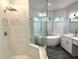 Luxurious bathroom with a large shower, soaking tub, and double vanity at 6218 Bridleford Dr, Wesley Chapel, FL 33545