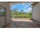 Large screened porch with tile flooring and nature views at 6218 Bridleford Dr, Wesley Chapel, FL 33545