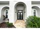 Elegant double front doors with arched entryway at 6218 Bridleford Dr, Wesley Chapel, FL 33545