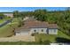 Aerial view of house showing large backyard and three car garage at 6218 Bridleford Dr, Wesley Chapel, FL 33545