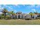 House exterior featuring Mediterranean style architecture and lush landscaping at 6218 Bridleford Dr, Wesley Chapel, FL 33545