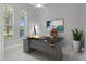 Bright home office features a large desk and windows at 6218 Bridleford Dr, Wesley Chapel, FL 33545