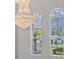 Two large arched windows with blinds, offering ample natural light at 6218 Bridleford Dr, Wesley Chapel, FL 33545