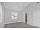 Main bedroom with vaulted ceiling, carpet, and ensuite bathroom at 6218 Bridleford Dr, Wesley Chapel, FL 33545