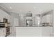 Bright kitchen featuring white cabinets and a large island at 6218 Bridleford Dr, Wesley Chapel, FL 33545