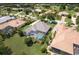 A home with screened-in pool with meticulously maintained landscaping at 33724 Americana Ave, Dade City, FL 33525