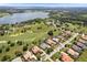 Aerial view of home near a golf course and lake at 33724 Americana Ave, Dade City, FL 33525