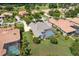 An aerial view of home with a screened-in pool with beautiful landscaping at 33724 Americana Ave, Dade City, FL 33525