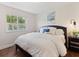 Cozy bedroom with a window that offers a view of the outdoors and a comfortable bed at 33724 Americana Ave, Dade City, FL 33525