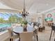 Inviting dining area with backyard views, adjacent to the spacious living room at 33724 Americana Ave, Dade City, FL 33525
