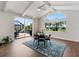 Bright dining area with vaulted ceilings and views to the patio and surrounding green space at 33724 Americana Ave, Dade City, FL 33525