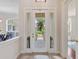 Grand entryway with glass front door, decorative sidelights, and backyard view at 33724 Americana Ave, Dade City, FL 33525