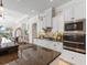 Modern kitchen featuring granite countertops, stainless steel appliances, and ample cabinetry at 33724 Americana Ave, Dade City, FL 33525