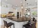 Modern kitchen with granite countertops, stainless steel appliances, and a center island with seating at 33724 Americana Ave, Dade City, FL 33525