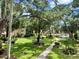 Lush landscaping surrounds this condo community, which features a pond and walking paths at 315 30Th W Ave # B207, Bradenton, FL 34205