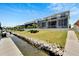 Beautiful backyard featuring a well-maintained lawn, access to a private dock, and canal views at 5243 Wishing Arch Dr, Apollo Beach, FL 33572