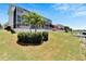 Lush lawn extending to the canal, complemented by a screened-in lanai and a private dock at 5243 Wishing Arch Dr, Apollo Beach, FL 33572