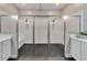 Modern bathroom featuring a large walk-in shower with black tile floors and white subway tile walls at 5243 Wishing Arch Dr, Apollo Beach, FL 33572