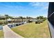 Picturesque view of the canal showcasing lush landscaping, private docks, and waterfront homes at 5243 Wishing Arch Dr, Apollo Beach, FL 33572
