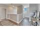 Upstairs hallway boasting modern floors, neutral paint, and contemporary fixtures at 5243 Wishing Arch Dr, Apollo Beach, FL 33572