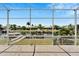 Serene canal view from the screened-in lanai, showcasing nearby docks and lush landscaping at 5243 Wishing Arch Dr, Apollo Beach, FL 33572