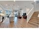 Spacious living area with an open-concept design, wood flooring, and abundant natural light at 5243 Wishing Arch Dr, Apollo Beach, FL 33572