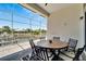 Screened-in patio featuring a table and chairs with scenic views of the waterfront at 5243 Wishing Arch Dr, Apollo Beach, FL 33572