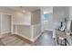 Bright and airy hallway with wood-look flooring at 5243 Wishing Arch Dr, Apollo Beach, FL 33572