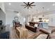 Open living room, showcasing the home's modern design and hardwood floors at 5243 Wishing Arch Dr, Apollo Beach, FL 33572