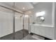 Modern bathroom with a large walk-in shower and white vanity at 5243 Wishing Arch Dr, Apollo Beach, FL 33572