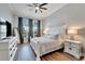 Spacious bedroom with king-size bed and wood floors at 5243 Wishing Arch Dr, Apollo Beach, FL 33572