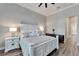 Main bedroom with king bed, nightstands, and ensuite bathroom access at 5243 Wishing Arch Dr, Apollo Beach, FL 33572