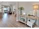 Bright and spacious entryway with hardwood floors and stylish console table at 5243 Wishing Arch Dr, Apollo Beach, FL 33572