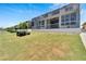 Spacious backyard with lush lawn and canal views at 5243 Wishing Arch Dr, Apollo Beach, FL 33572