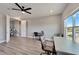 Bright office space with hardwood floors, large window and two desks at 5243 Wishing Arch Dr, Apollo Beach, FL 33572