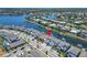 Aerial view highlighting the home's waterfront access and neighborhood at 5243 Wishing Arch Dr, Apollo Beach, FL 33572