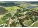 Expansive property showcased from above, highlighting the property's layout, buildings, and bordering landscape at 12922 672 Hwy, Riverview, FL 33579