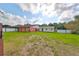 View of the buildings on the property with green grass in the backyard at 12922 672 Hwy, Riverview, FL 33579