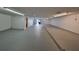 Spacious basement with painted walls and concrete floors at 12922 672 Hwy, Riverview, FL 33579