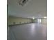 Large unfinished basement with concrete floor and drop ceiling at 12922 672 Hwy, Riverview, FL 33579