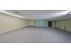 Spacious unfinished basement area with concrete flooring and exposed utilities at 12922 672 Hwy, Riverview, FL 33579