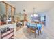 An ample dining room with tile flooring and a blue dining table at 12922 672 Hwy, Riverview, FL 33579