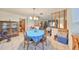 An ample dining room with tile flooring and a blue dining table at 12922 672 Hwy, Riverview, FL 33579